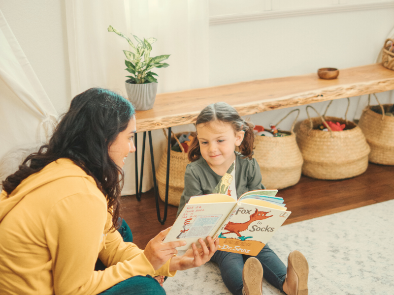 Educator working with a preschool child in a home care setting