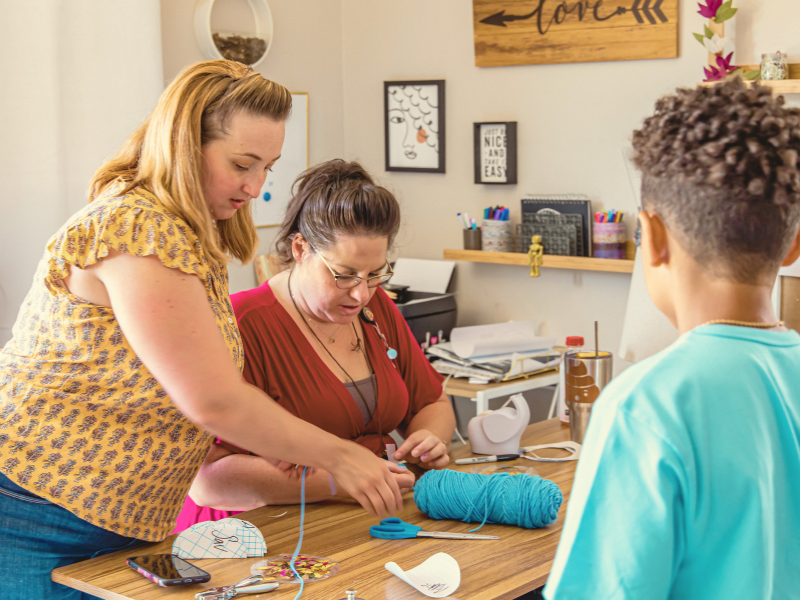 Teachers working together in a early childhood education preschool classroom
